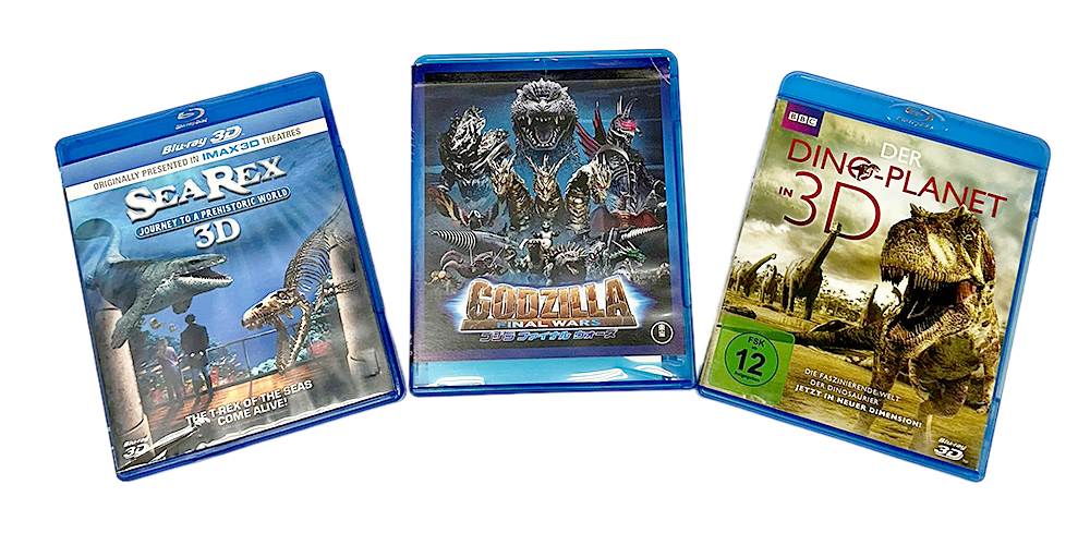 Three dinosaur-themed Blu-ray cases, including "Dinosaur Planet 3D," displayed for product sale.