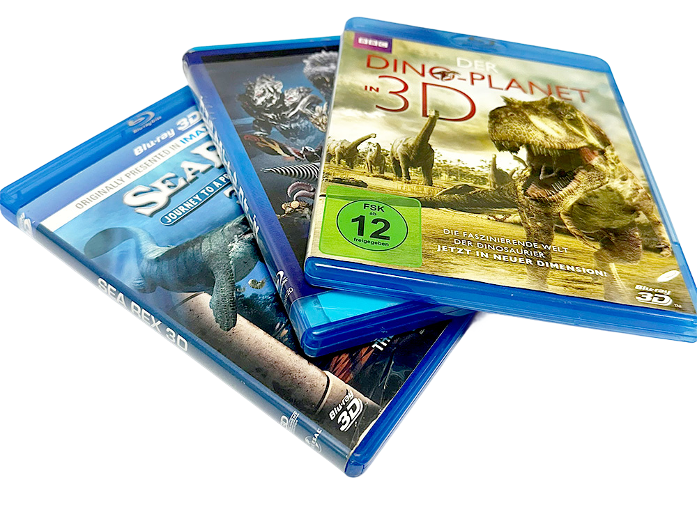 Three Blu-ray cases, with "Dino Planet in 3D" featuring dinosaurs on the cover, displayed at an angle.
