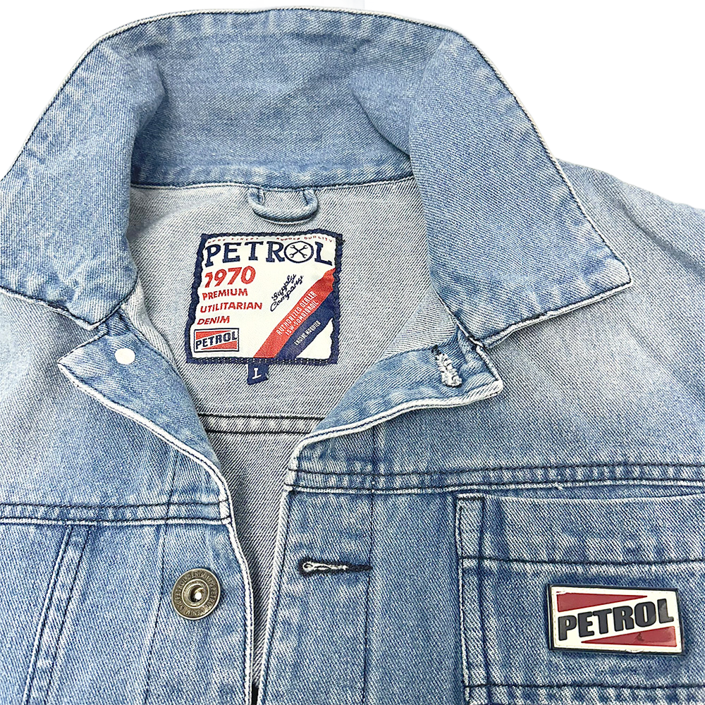 Light blue Petrol denim jacket with button closure, chest pocket, and branded Petrol patches on the front.
