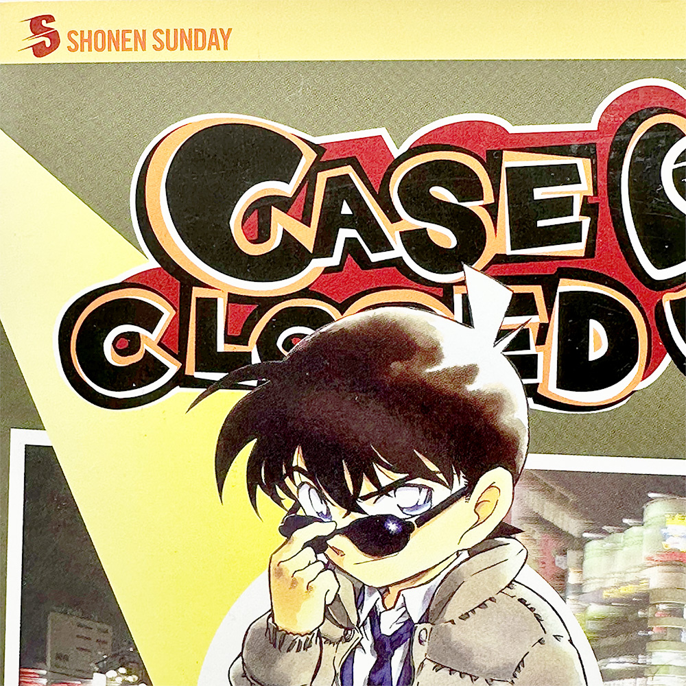 Detective Conan Volume 37 cover featuring Conan Edogawa adjusting sunglasses with a serious expression.