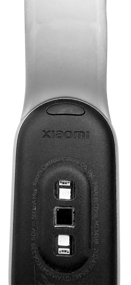 Back view of the Xiaomi Smart Band 9 showing the heart rate sensor and charging contacts on the strap.