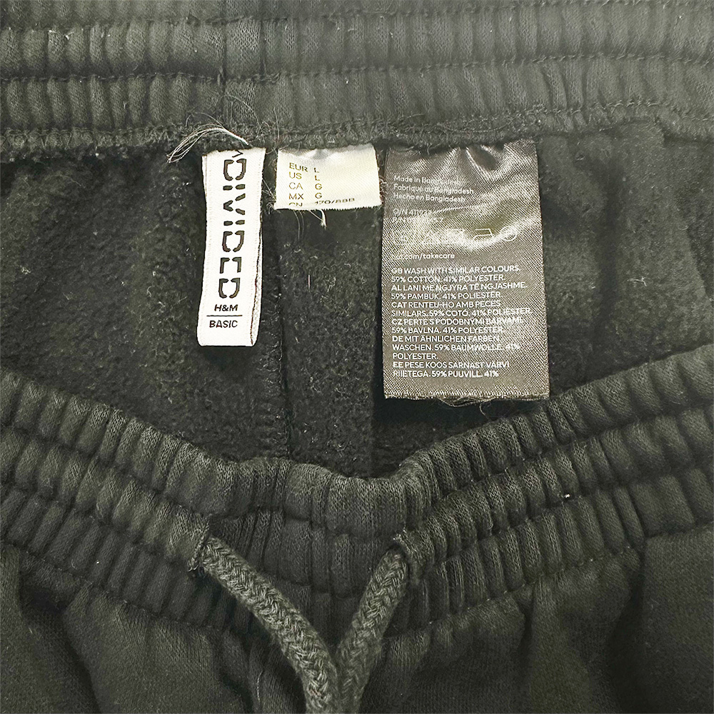 Close-up of waistband and inner labels on black H&M Women’s Basic Sweatpants.