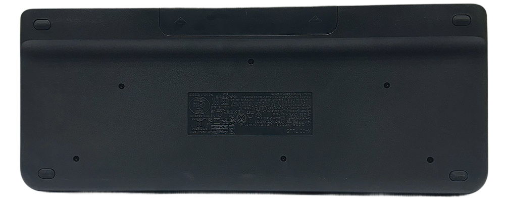 Back view of the Logitech K400 Wireless Keyboard showing its battery compartment and product label.