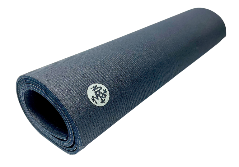 Rolled-up Manduka PROlite Yoga Mat in dark blue with logo visible on the surface.