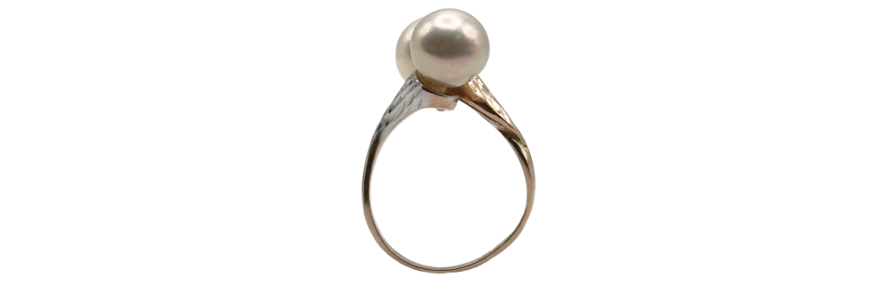Gold-tone ring featuring a round white pearl set on a slender, textured band.