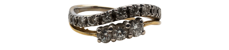 White gold diamond ring with a wavy band design, featuring rows of sparkling diamonds.