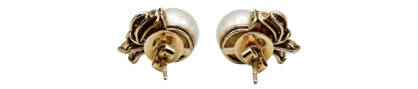 Pair of pearl gold earrings with intricate floral design, displayed against a white background.