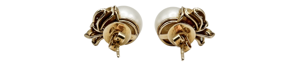 Pair of pearl gold earrings with intricate floral design, displayed against a white background.