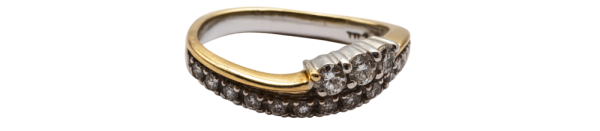White gold diamond ring with a row of sparkling diamonds set in an elegant, modern band design.