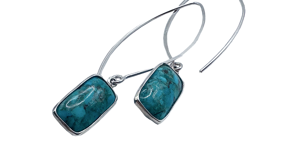 Silver drop earrings featuring rectangular turquoise stones with delicate wire hooks.