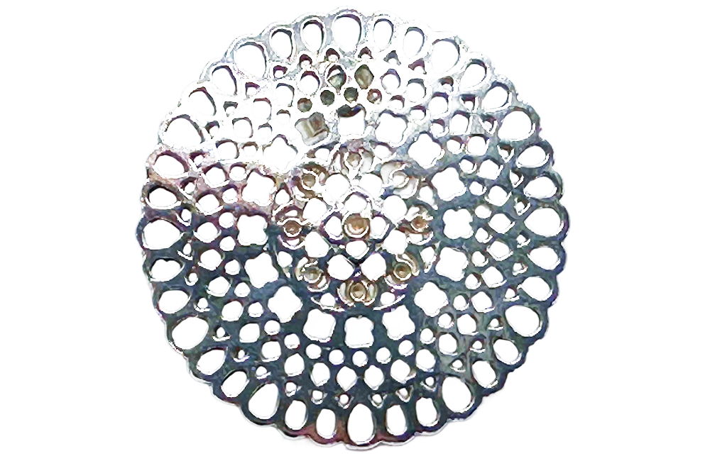 Close-up of a single silver disc earring with intricate, lacy filigree design, featured on a product page.