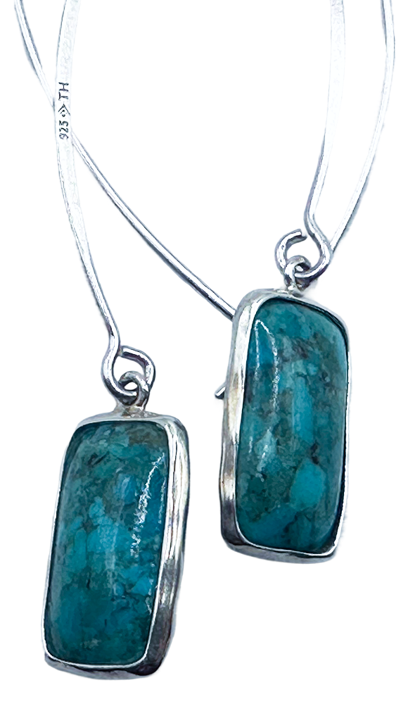 Silver drop earrings with rectangular turquoise stones, featuring a sleek and elegant design.