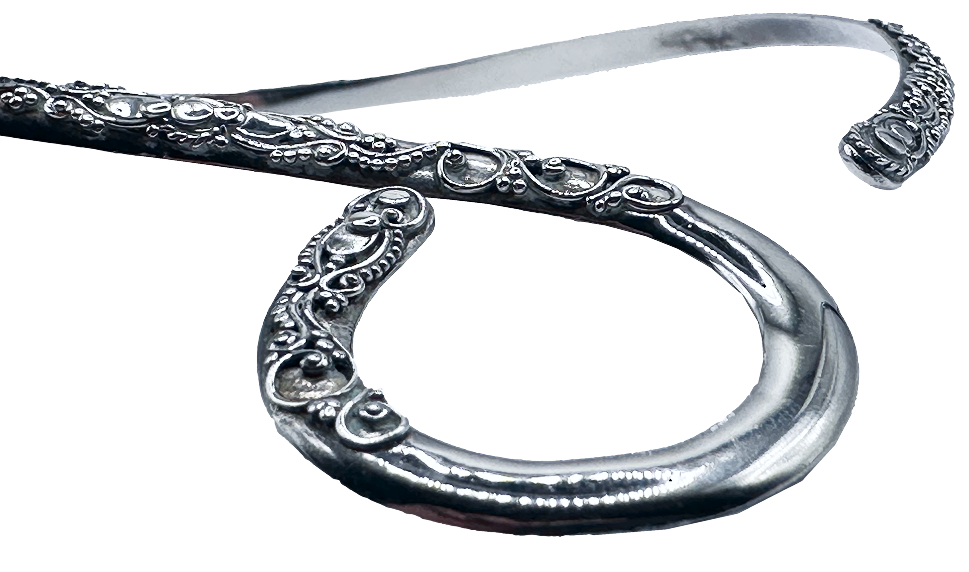 Close-up of the Silver Loop Open Collar Necklace with intricate engraved detailing on both ends.