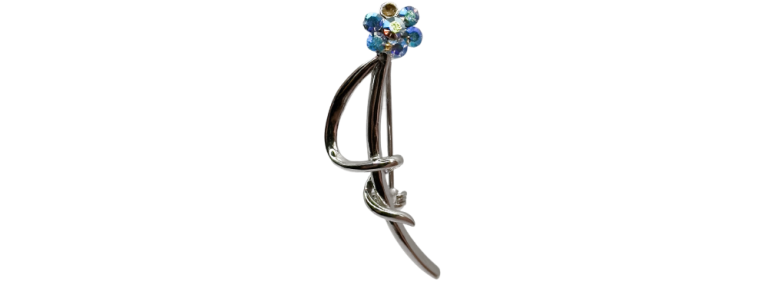 Silver floral crystal brooch featuring blue and clear gemstones in a delicate, curved stem design.