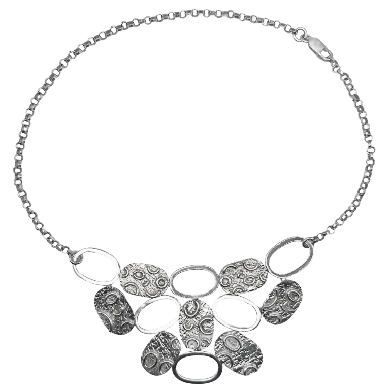 Silver disc necklace with textured oval and round links on a matching chain, displayed against a white background.