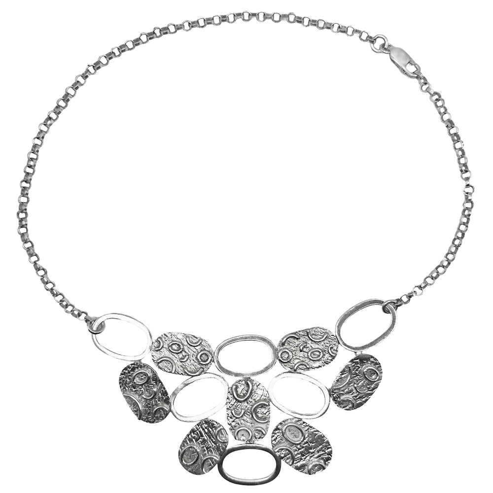 Silver disc necklace with textured oval and round links on a matching chain, displayed against a white background.