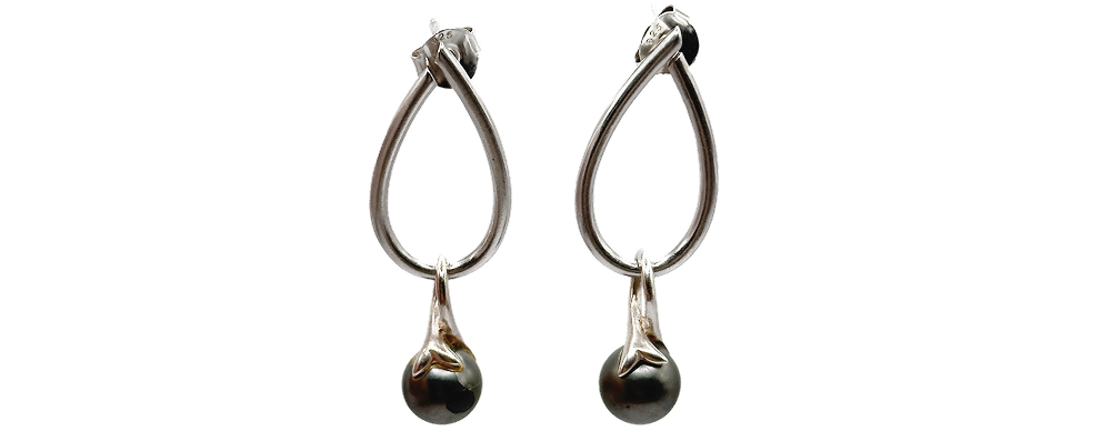 Pair of silver drop earrings with teardrop-shaped hoops and spherical accents at the bottom.