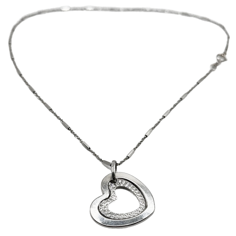 Silver heart pendant necklace with a delicate chain, displayed on a white background.