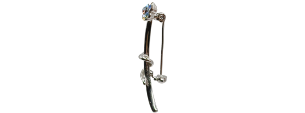 Silver floral crystal brooch with a stem design and sparkling gem accents.