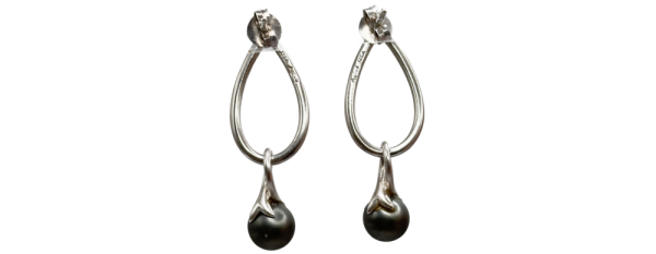 Pair of elegant silver drop earrings with teardrop-shaped hoops and dark round gemstone pendants.