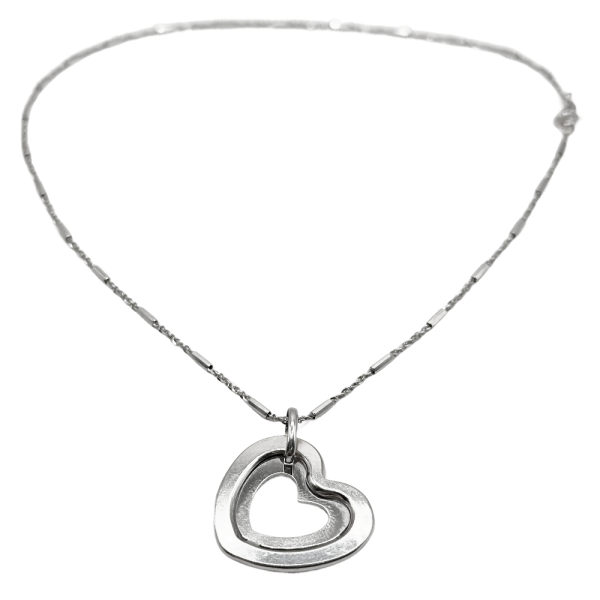 Silver heart pendant necklace with a delicate chain, featuring an open double-heart design.