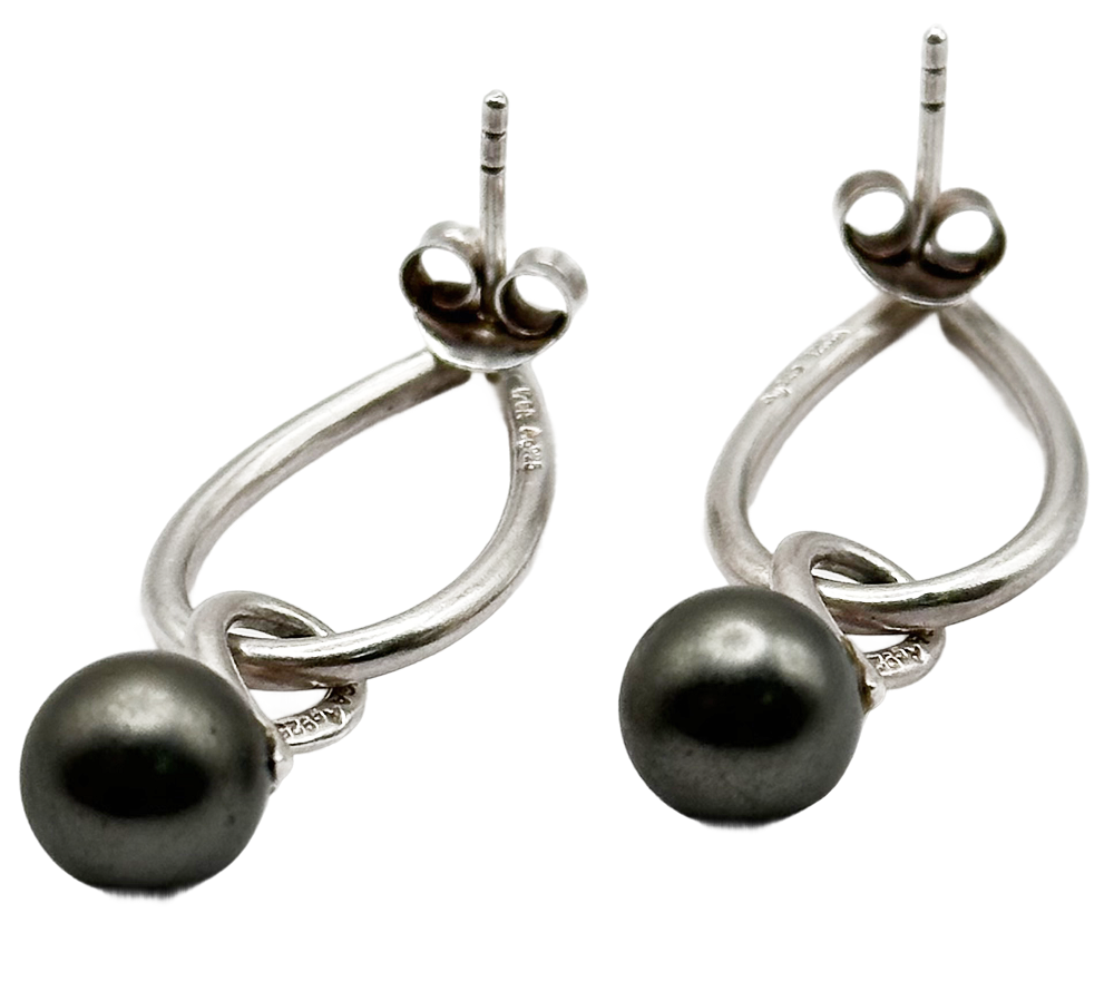 Pair of silver drop earrings with looped design and round metallic bead accents.