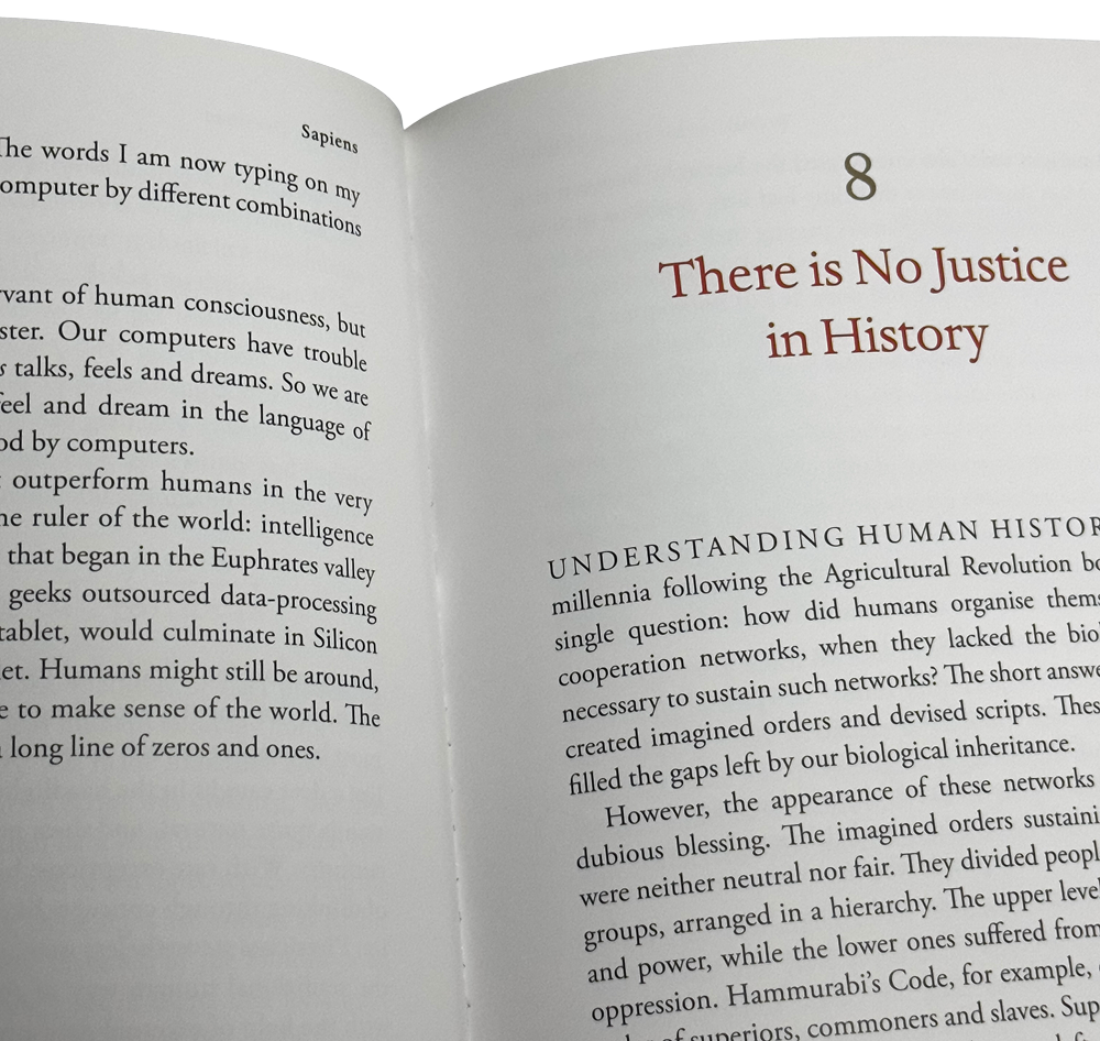 Open book showing chapter 8, titled "There is No Justice in History," from Sapiens.
